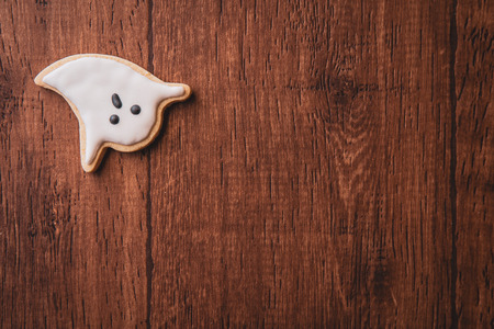 Fresh delicious homemade decorated halloween cookies sweets on dark wooden background, concept of...