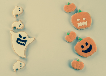Fresh delicious homemade decorated halloween cookies sweets on dark wooden background, concept of halloween party, copy space(text space), top view, blank for text.の写真素材