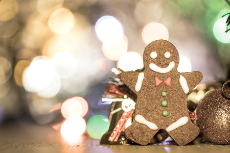 Cute gingerbread man with christmas tree and blurry sparkle background, close up, bokeh, text space(copy space)の写真素材