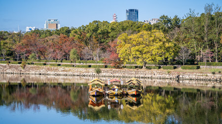 Osaka, Japan, November 25, 2018: Osaka castle ship (osaka jyo gozabune) in grand and beautiful world famous Osaka castle river in autumn with blue sky, Japan, close upのeditorial素材