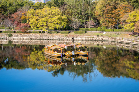 Osaka, Japan, November 25, 2018: Osaka castle ship (osaka jyo gozabune) in grand and beautiful world famous Osaka castle river in autumn with blue sky, Japan, close upのeditorial素材