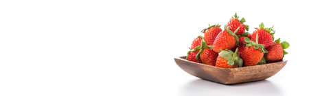 A bowl of beautiful strawberries isolated on white backgroundの写真素材