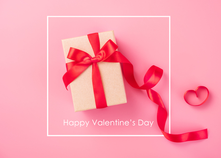 Gift box with  red ribbon and rose, concept of Valentine's, anniversary, mother's day and birthday greeting, copy space, top view.の写真素材