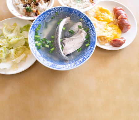 Milkfish skin soup, distinctive Taiwan delicacy food in Tainan. Famous meal set for lunch or breakfast with vegetable, top view, copy space, close upの写真素材