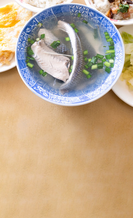Milkfish skin soup, distinctive Taiwan delicacy food in Tainan. Famous meal set for lunch or breakfast with vegetable, top view, copy space, close upの写真素材