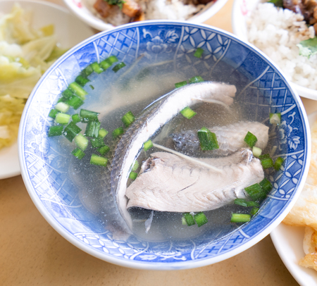 Milkfish skin soup, distinctive Taiwan delicacy food in Tainan. Famous meal set for lunch or breakfast with vegetable, top view, copy space, close upの写真素材