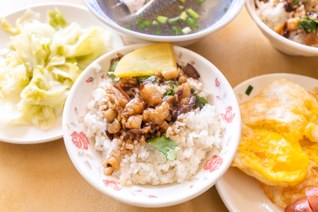 Braised pork over rice - Taiwan famous traditional street food delicacy. Soy-stewed pork on rice. Travel design concept. Top view,copy space,close upの写真素材
