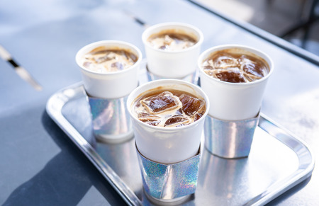 Coffee time with friends, cups of drink in coffeehouse, party concept, happy hangout together in cafe, lifestyle, copy space, top view, close upの写真素材