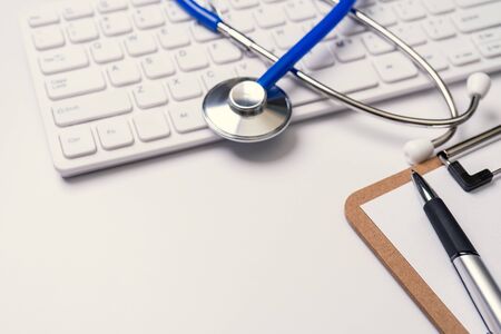 Medical Concept - Stethoscope on computer keyboard on white background. Close up, macro, copy spaceの写真素材