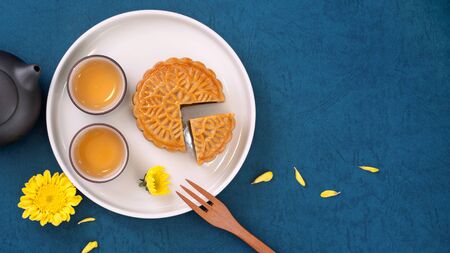 Flat lay of Mid-Autumn Festival concept design of mooncakes and tea set with copy spaceの写真素材