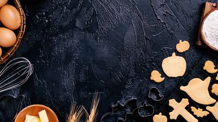 Concept of making Halloween cookies, baking recipe ingredients layout of preparing party, top view, flat lay, copy space.の写真素材