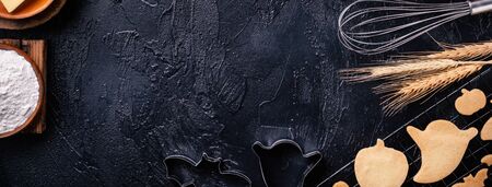 Concept of making Halloween cookies, baking recipe ingredients layout of preparing party, top view, flat lay, copy space.の写真素材