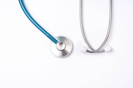Blue stethoscope, object of doctor equipment, isolated on white background. Medical design concept, top viewの写真素材
