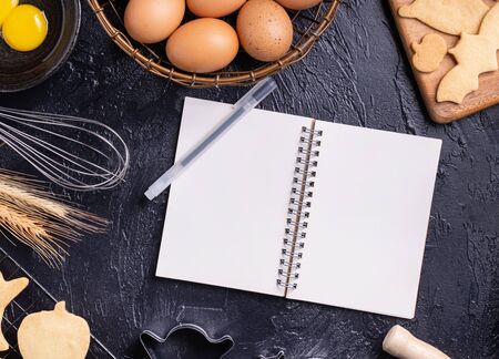 Making cookies cookbook recipe design concept, baking ingredients preparation layout with notebook, top view, flat lay, overhead, mockup copy space.の写真素材