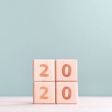 Abstract 2020, 2019 New year target plan design concept - wood blocks cubes on wooden table and...