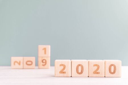 Abstract 2020, 2019 New year target plan design concept - wood blocks cubes on wooden table and...