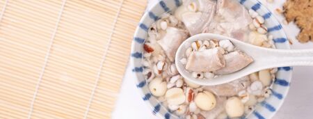 Tasty Four Tonics Herb Flavor Soup,Taiwanese traditional food with herbs,pork intestines on white wooden table,close up,flat lay,top viewの写真素材
