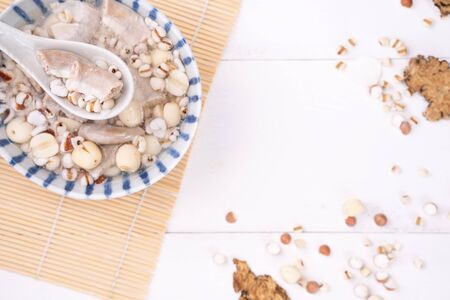 Tasty Four Tonics Herb Flavor Soup,Taiwanese traditional food with herbs,pork intestines on white wooden table,close up,flat lay,top viewの写真素材