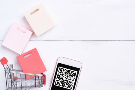 Abstract online shopping,mobile payment with QR code design concept element,colorful cart,paper bag...