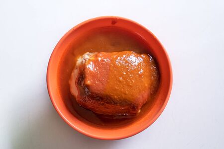 Tamsui agei (age, aburaage), delicious famous street food in Taipei, Taiwan, stuffed with mung bean noodles and chili sauce topping, lifestyle, close up.の写真素材