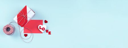 Valentine's Day  gift and card isolated on pastel  blue  background, flat lay, top view.の写真素材