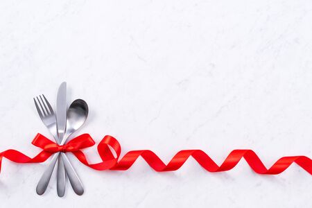 Valentine's Day meal design concept - Romantic plate dish set isolated on marble white background for restaurant holiday celebration promo, top view, flat lay.の写真素材
