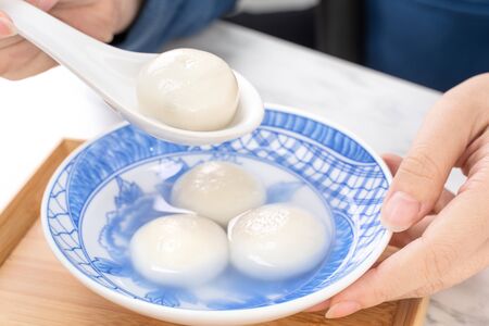 Delicious tang yuan, yuanxiao in a small bowl. Asian traditional festive food rice dumplings ball...