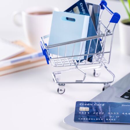 Office online paying, stay home shopping, electronic payment with credit card concept, laptop on...