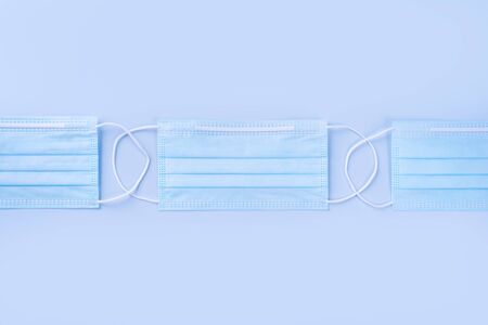 Blue mask - medical equipment with stethoscope, concept of world disease pandemic infection and...