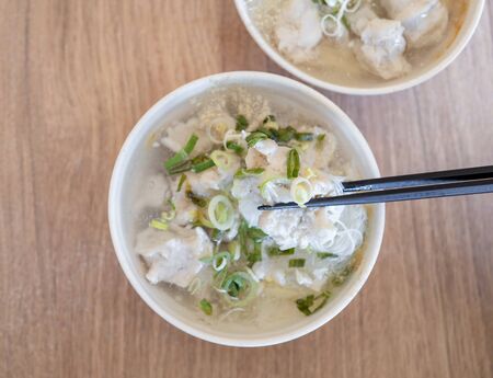 Delicious fish ball rice noodles in thick soup, common food in Tainan, Taiwan, Asia, Asian Taiwanese street delicacy cuisine, close up, lifestyle.の写真素材