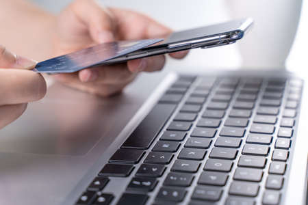 Office online paying, stay home shopping, electronic payment with credit card concept, laptop on...