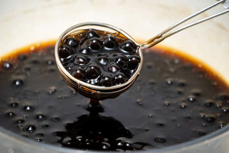 Cooking, boiling brown sugar flavor tapioca pearl balls, ingredient of bubble teaの写真素材