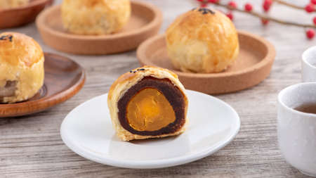 Moon cake yolk pastry, mooncake for Mid-Autumn Festival holiday, top view design concept on bright...