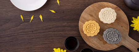 Colorful beautiful moon cake, mung bean cake, Champion Scholar Pastry cake for Mid-Autumn festival traditional gourmet dessert snack, top view, flat lay.の写真素材