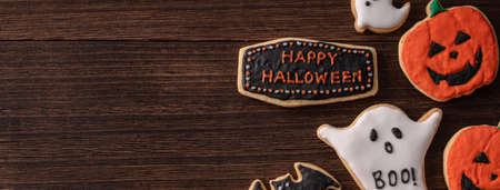 Top view of Halloween festive decorated icing gingerbread sugar cookies with copy space and flat lay layout.の写真素材