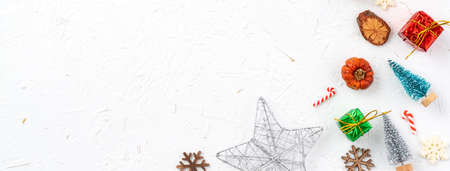 Top view of Christmas holiday decoration ornament composition with Christmas tree, gift star,...