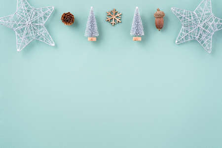 Top view of Christmas holiday decoration ornament composition with Christmas tree, gift star,...