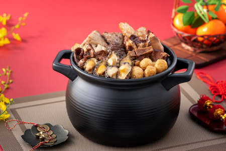 Traditional food of Chinese lunar new year, Buddha jumps over the wall, Chinese Soup Casserole dish, Buddha's Temptation, named Fo Tiao Qiang, close up.の写真素材