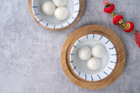 Top view of big tangyuan yuanxiao (glutinous rice dumpling balls) for lunar new year festival food, words on the golden coin means the Dynasty name it made.の写真素材
