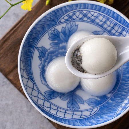 Top view of big tangyuan yuanxiao (glutinous rice dumpling balls) for lunar new year festival food, words on the golden coin means the Dynasty name it made.の写真素材