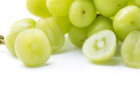 Close up of beautiful a bunch of Shine Muscat green grape isolated on white backgroundの写真素材
