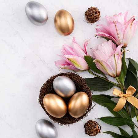 Design concept of Golden and silver Easter eggs in the nest with pink lily flower on bright marble...