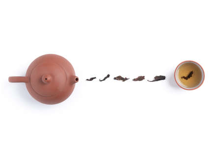 Top view of fresh black tea with kettle teapot and leaves in Taiwan, Asian culture design concept...