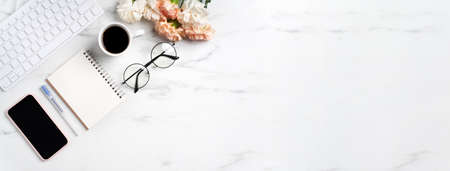 Mother's Day concept. Top view of greeting with carnation flower on mother's office table desk...