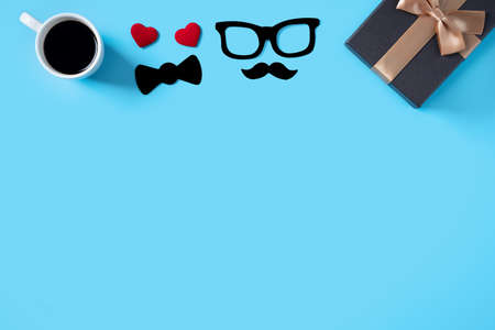 Father's day background design concept. Top view of color paper decoration layout ideas with gift box on blue table background with copy space.の写真素材