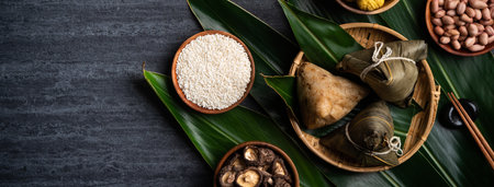 Zongzi. Rice dumpling top view design concept for Chinese traditional Dragon Boat Festival (Duanwu Festival) over dark black slate background.の写真素材
