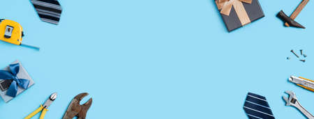 Top view design concept of Father's day and labor day with working tools on blue background.