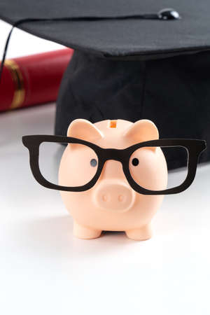 Design concept of new fresh graduate trying to find a job and learning to earnig and saving money.の写真素材
