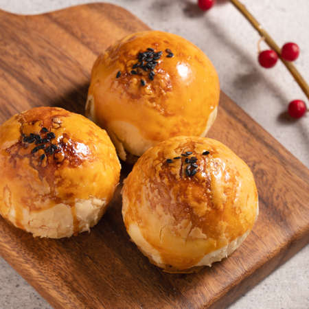Close up of Moon cake yolk pastry, mooncake for Mid-Autumn Festival holiday on gray table background