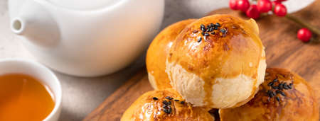 Close up of Moon cake yolk pastry, mooncake for Mid-Autumn Festival holiday on gray table background